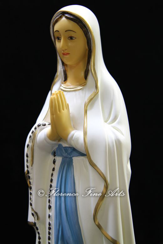 This auction is for a statue of the Our Lady of Lourdess Hand Painted 